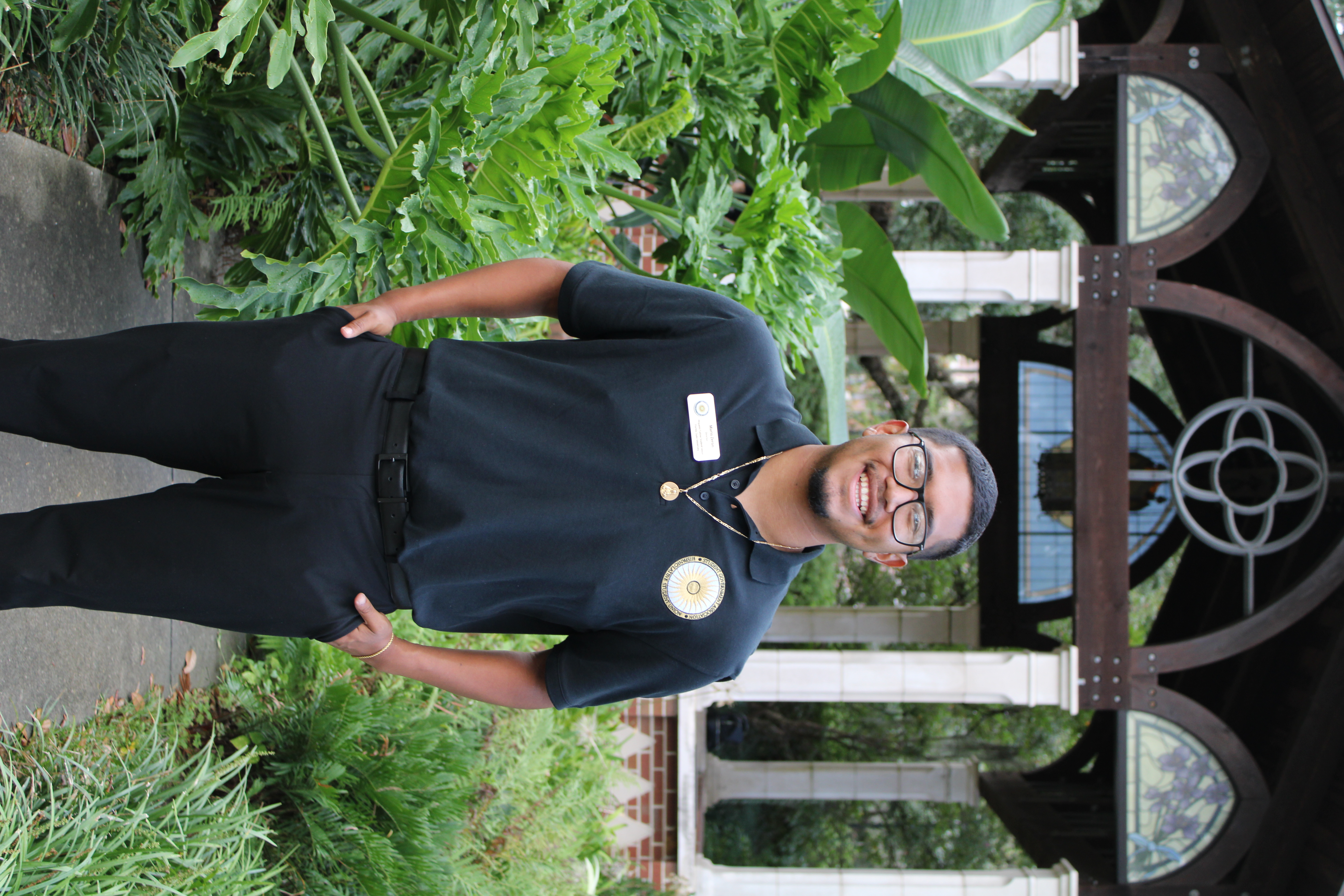 student standing and smiling
