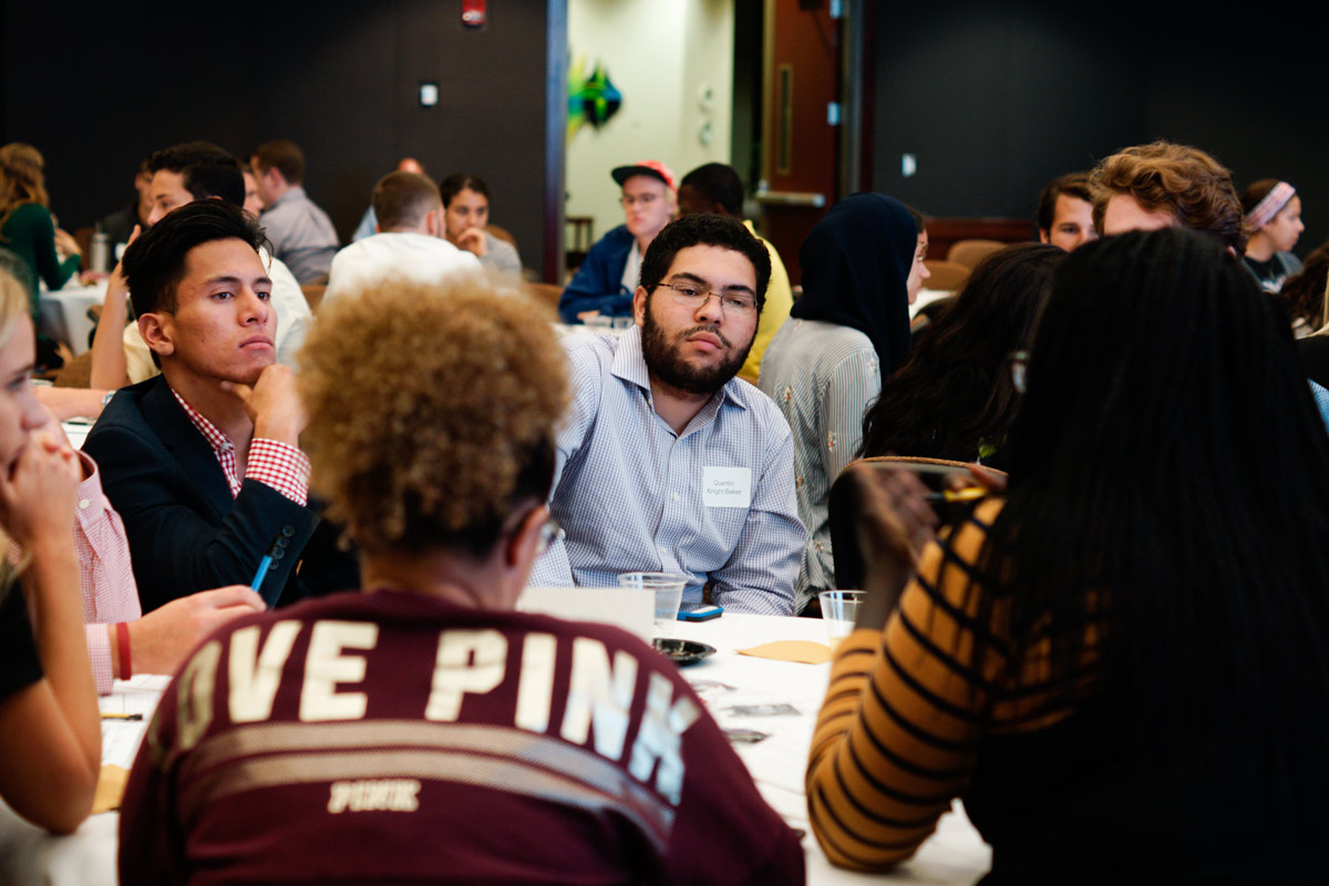 Photo of Shared Spaces Series participants chatting at their respective tables
