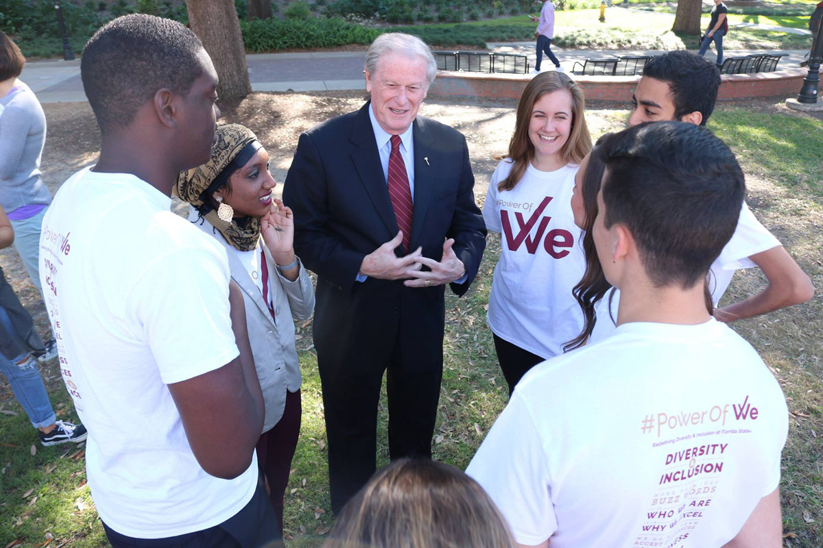 President Thrasher speaking with Power of We students